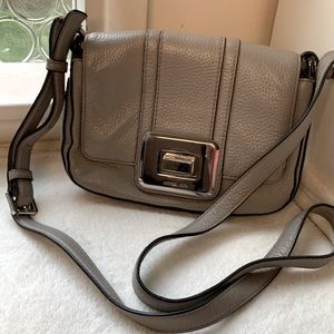 Michael Kors grey leather crossbody with sliver turn lock closure.